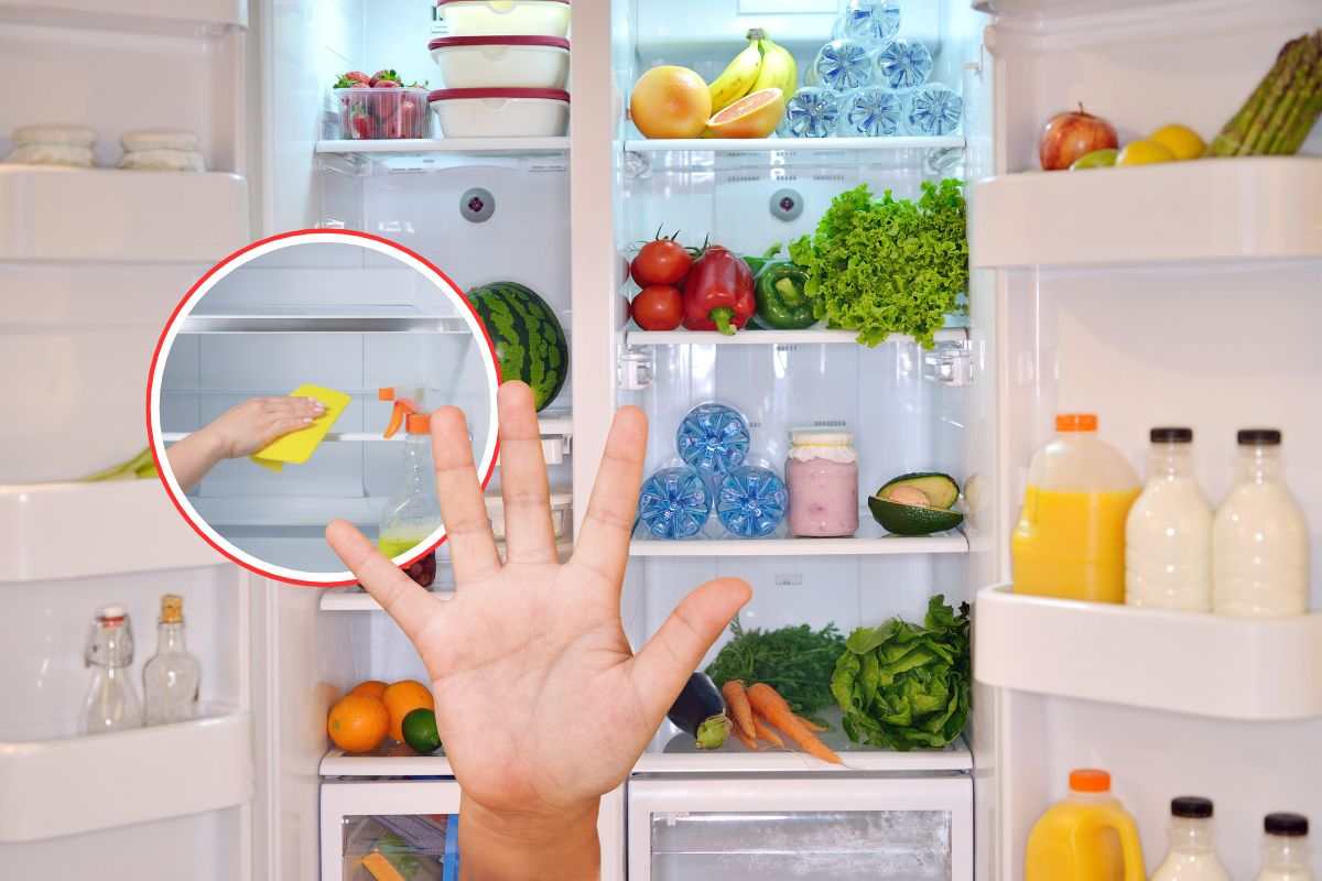 pulizia frigo, mano e frigo aperto